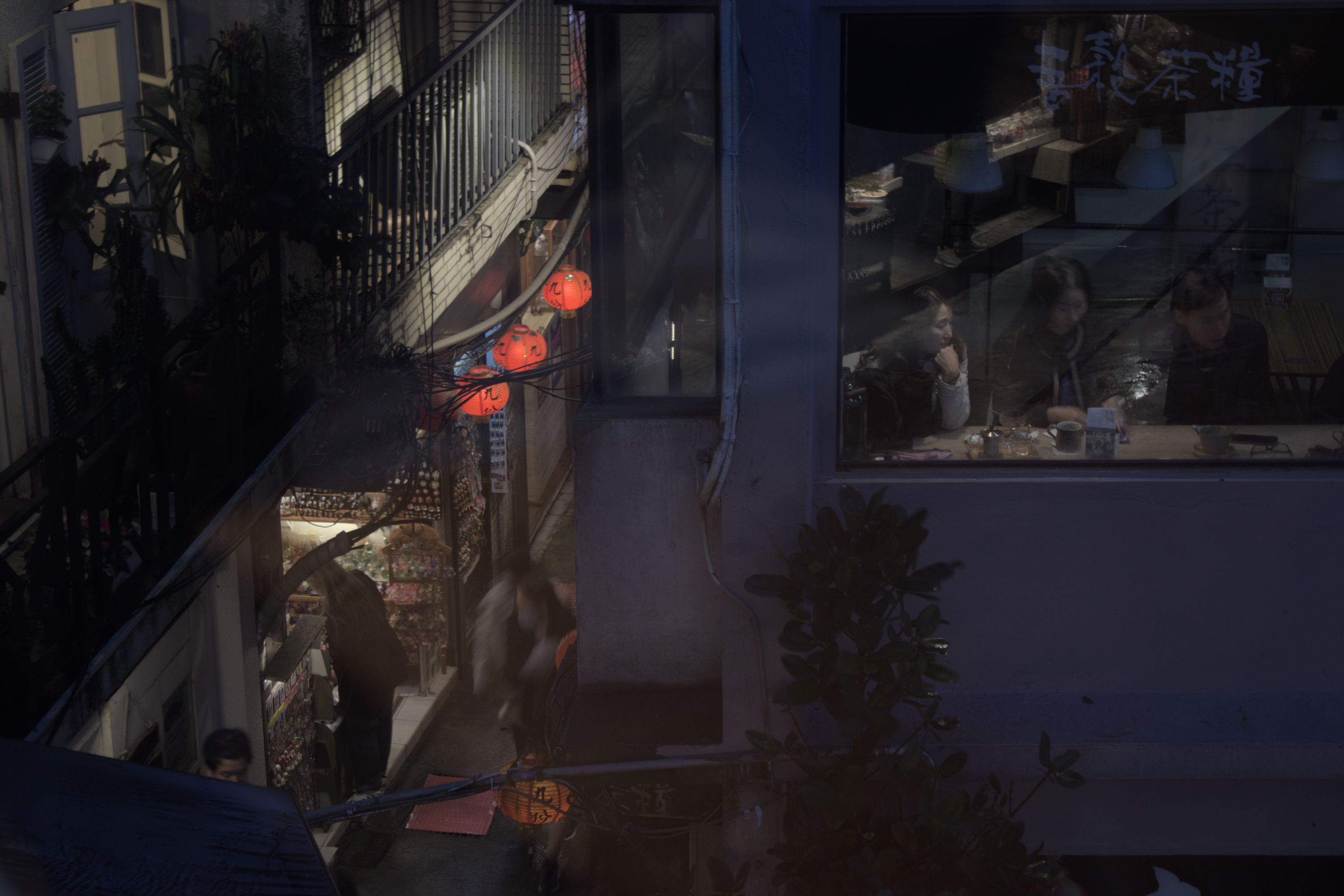 View from the window of our chosen tea house; the people in the window are at a different tea house, and down below is one of the souvenir selling alleyways.